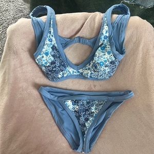 Cute bathing suit !! The top is a medium. The bottoms are a small!